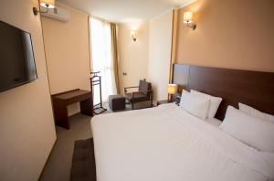 Postel nebo postele na pokoji v ubytování Hotel Corner Inn