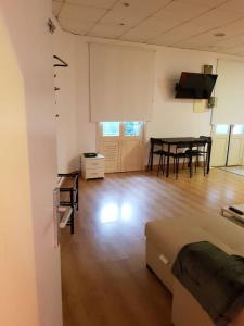 a living room with a table and chairs in it at Donostia Apartment Parking Included in San Sebastián