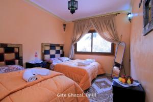 Uma cama ou camas num quarto em Chez Ghazal Imlil