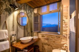 a bathroom with a sink and a window at Borgo Antichi Orti Assisi in Assisi +110 photos