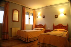 
Cama o camas de una habitación en Pensión Bilbao
