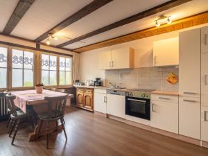 a kitchen with a table and a dining room at Ferienwohnung mit Talblick in Todtmoos in Todtmoos