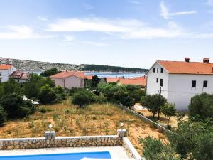 a view of a house and a swimming pool at Vila Anica in Barbat na Rabu