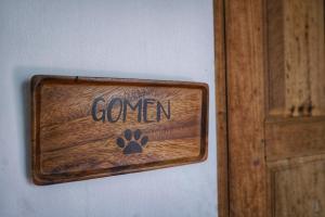 a sign that says cannon with a paw on a wall at Sukjai Guesthouse in Chiang Mai