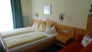 Postel nebo postele na pokoji v ubytování Hotel Sportpension Reiter