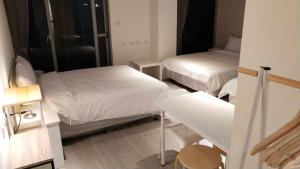 Katil atau katil-katil dalam bilik di 駐駐逢甲 Shine Residence
