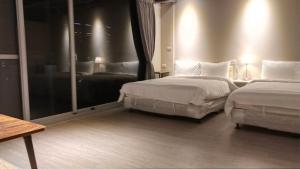 Katil atau katil-katil dalam bilik di 駐駐逢甲 Shine Residence