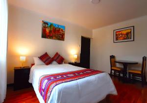 Cama ou camas em um quarto em Hotel Santa Maria