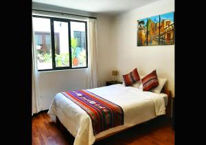 Cama ou camas em um quarto em Hotel Santa Maria