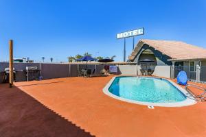 a pool on the roof of a hotel at Americas Best Value Inn and Suites El Centro in El Centro