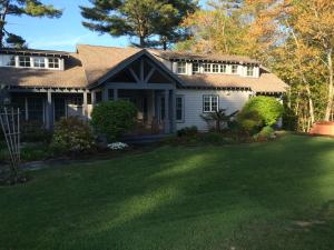 a house with a large lawn in front of it at Maple Hill Farm Bed & Breakfast in New London