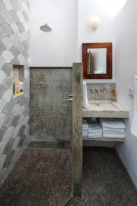 a bathroom with a sink and a mirror at Villas Robalo / Dorado Penthouses in Sayulita +19 photos