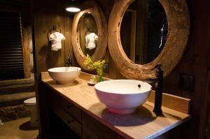 a bathroom with a sink and a mirror at Zion Mountain Ranch in Mount Carmel Junction