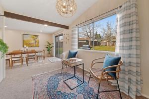 a living room with a table and chairs at Home in the Silicon Forest in Beaverton