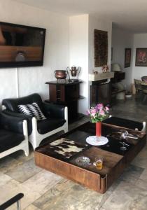 a living room with a couch and a coffee table at Departamento Mar Punta del Este in Punta del Este