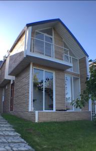a house with a large window on the side of it at loft puerto varas in Puerto Varas