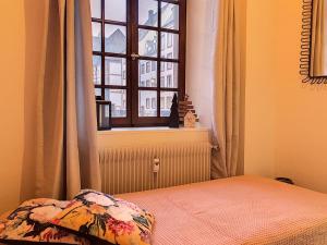 Postel nebo postele na pokoji v ubytování LOVELY COLMAR + 3 fotografie