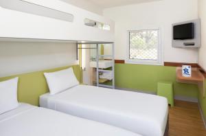 Postel nebo postele na pokoji v ubytování ibis Budget - Newcastle
