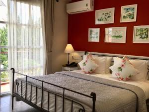 Postel nebo postele na pokoji v ubytování BICH DAO Boutique - Dalat