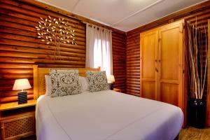 Voodi või voodid majutusasutuse Sunset Lodge toas
