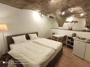 Kuchyň nebo kuchyňský kout v ubytování Aparthotel Cross Street 4