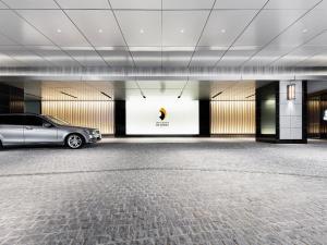 a car parked in a parking lot in a building at Hotel Hankyu RESPIRE OSAKA in Osaka