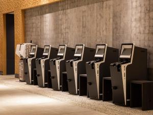 a row of computer monitors in a room at Hotel Hankyu RESPIRE OSAKA in Osaka +37 photos