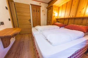 Posteľ alebo postele v izbe v ubytovaní Rifugio Lago Nambino
