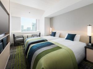 Postel nebo postele na pokoji v ubytování Hotel Hankyu RESPIRE OSAKA + 36 fotografií