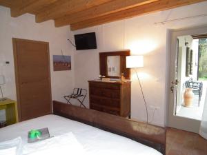 Postel nebo postele na pokoji v ubytování L'Isolo b&b e case vacanza