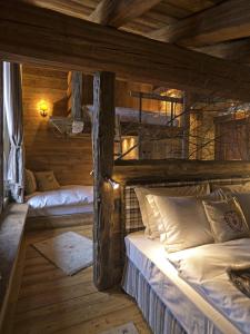 Ліжко або ліжка в номері Au Coeur Des Neiges & SPA
