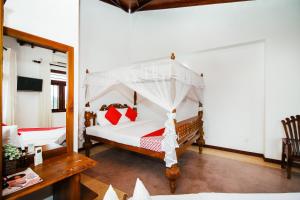 Giường trong phòng chung tại Arken Lanka