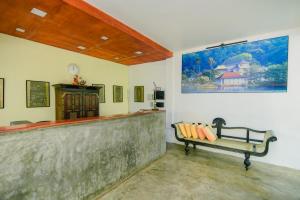 a baseball bar with a bench in a room at Jasmin Hill House in Kandy