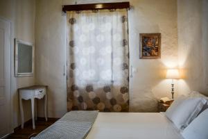 A bed or beds in a room at The Veranda of Gavrion-Exclusive, Centrally located with Seaview