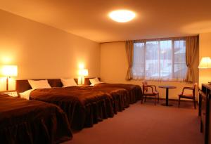 Postel nebo postele na pokoji v ubytování Hotel Oak Forest