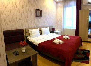 Кровать или кровати в номере Bonus Hotel