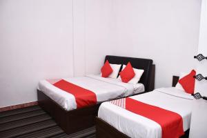 Postel nebo postele na pokoji v ubytování Roshan Guest House