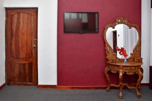 TV a/nebo společenská místnost v ubytování Roshan Guest House