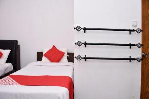 Postel nebo postele na pokoji v ubytování Roshan Guest House