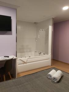 Postel nebo postele na pokoji v ubytování Hotel Reigosa