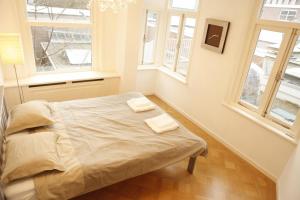 Amstel Apartments tesisinde bir odada yatak veya yataklar