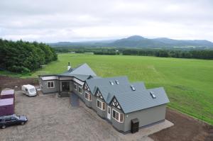 an aerial view of a house with a car parked in front at Polaris in Teshikaga