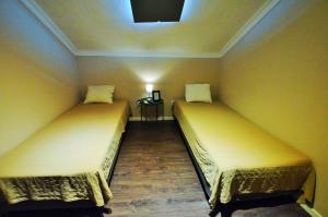 Postel nebo postele na pokoji v ubytování Rooms DP Setúbal