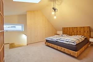 Postel nebo postele na pokoji v ubytování Mountain Apartments Klínovec Hexagon