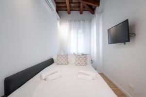 Кровать или кровати в номере Rooftop San Marco - Tower View