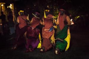 a group of people dressed up in costumes at night at Pench Jungle Camp in Khawāsa
