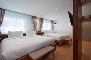P2 Wood Loft客房内的一张或多张床位