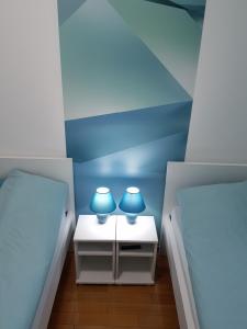 Voodi või voodid majutusasutuse Apartman KEJ BLUE free parking toas