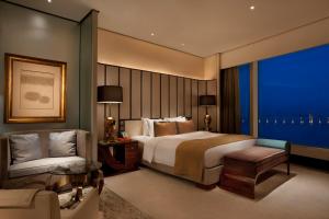 Tempat tidur dalam kamar di MGM Macau
