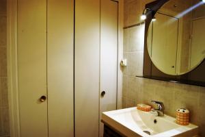 a bathroom with a sink and a mirror at studio 150 m de la mer in Six-Fours-les-Plages
